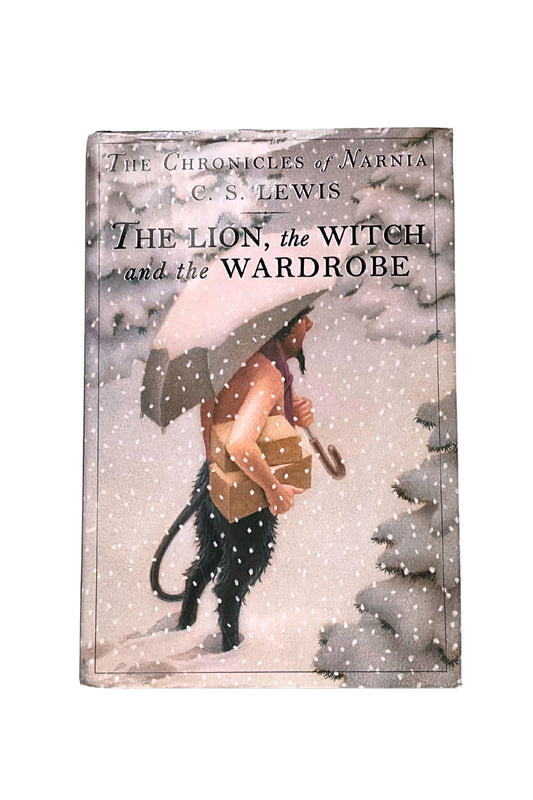 Book titled ‘The Lion, the Witch, and the Wardrobe by C.S. Lewis, showing  Mr Tumnus walking on a snowy landscape