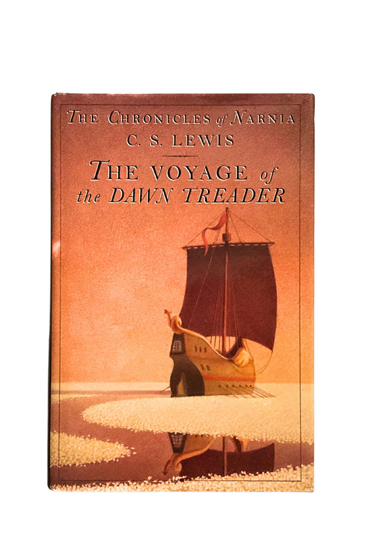 Book cover of 'The Voyage of the Dawn Treader' by C.S. Lewis with a ship on a beach.