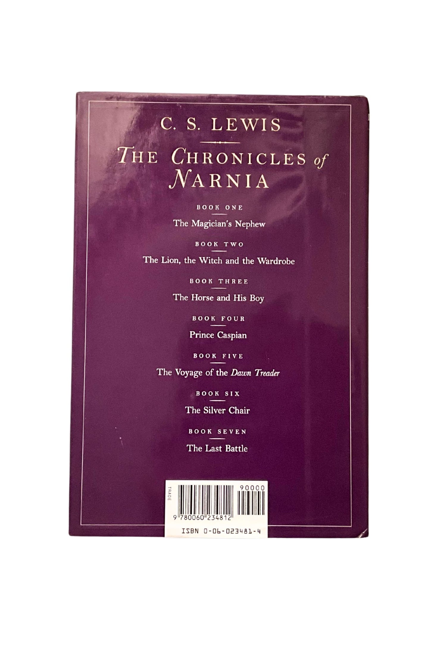 Back cover of 'The Lion, the Witch, and the Wardrobe' by C.S. Lewis with a list of every title in the Narnia series, on a white background