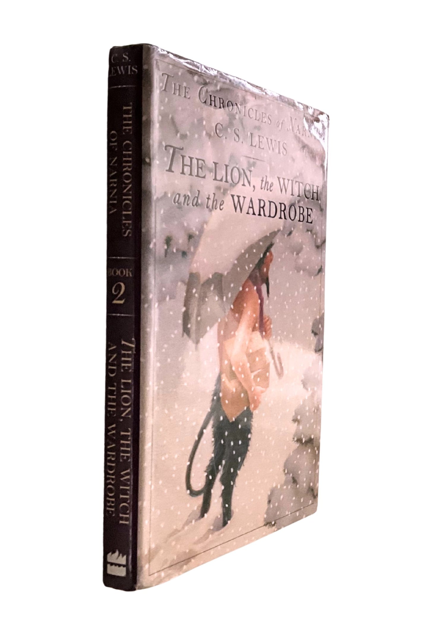Book cover of 'The Lion, the Witch and the Wardrobe' by C.S. Lewis, shown sideways