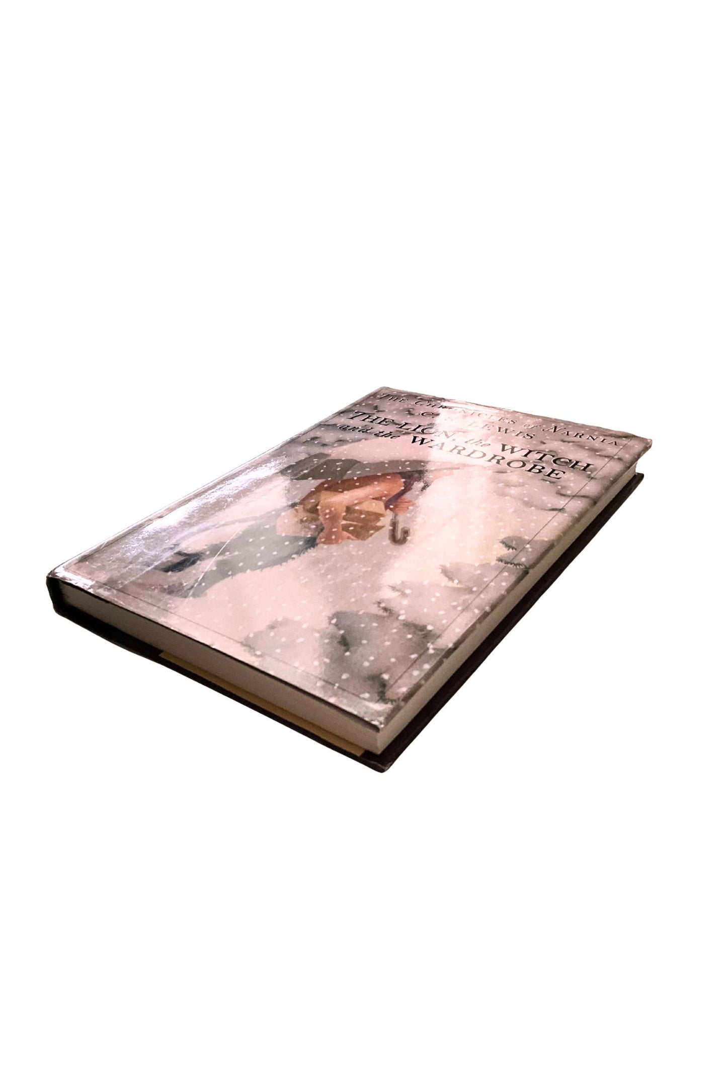 ‘The Lion, the Witch, and the Wardrobe' book on a white background