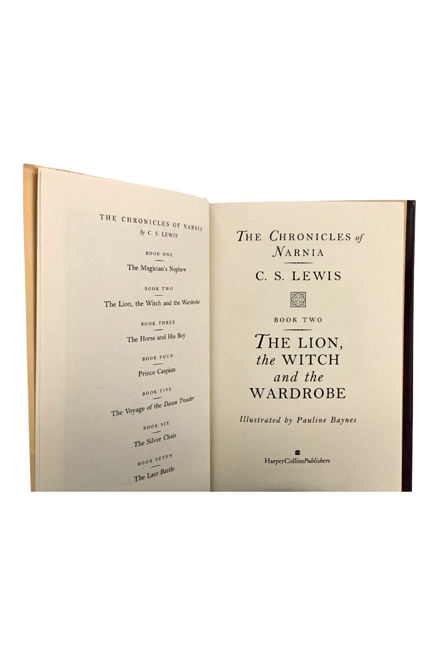 Open book titled 'The Chronicles of Narnia' by C.S. Lewis on a white background